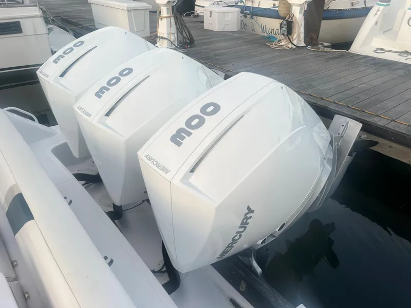 Slide: The Image of 2008 Donzi 38 ZSF with triple Mercury outboard engines docked. - 19