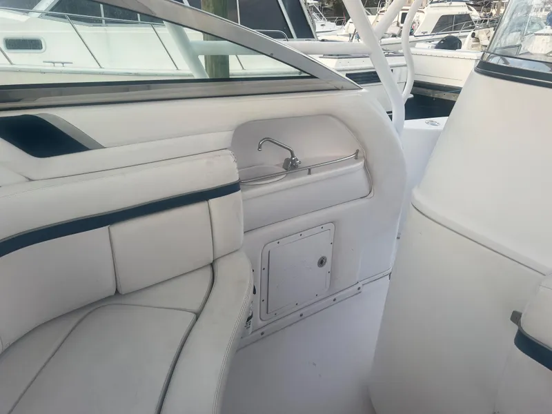 Slide: The Image of 2008 Donzi 38 ZSF boat interior with white seating and sink. - 29