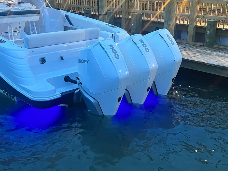 Slide: The Image of 2008 Donzi 38 ZSF boat with triple Mercury outboard engines and blue underwater lights. - 3