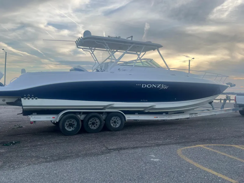 Slide: The Image of 2008 Donzi 38 ZSF boat on a trailer at sunset. - 9