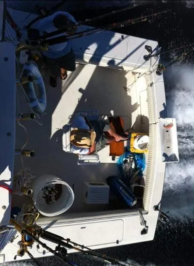 Slide: The Image of Top view of 2002 Jersey 36 Express boat with fishing gear and passengers. - 10