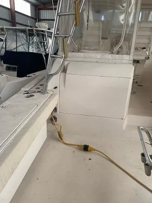 Slide: The Image of 2002 Jersey 36 Express boat interior with ladder and seating area. - 19