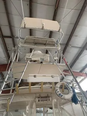 Slide: The Image of 2002 Jersey 36 Express boat in a covered storage facility. - 22