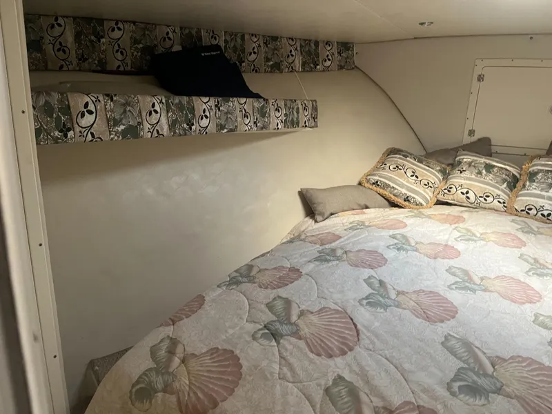 Slide: The Image of 2002 Jersey 36 Express cabin interior with bed and decorative pillows. - 27