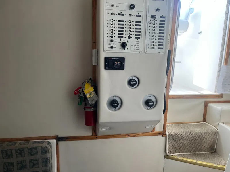 Slide: The Image of Control panel inside a 2002 Jersey 36 Express boat with fire extinguisher. - 31