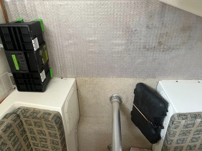 Slide: The Image of Interior of a 2002 Jersey 36 Express boat with storage compartments and seating. - 34