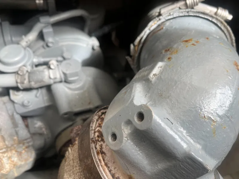 Slide: The Image of Close-up of a 2002 Jersey 36 Express engine component with visible rust. - 37