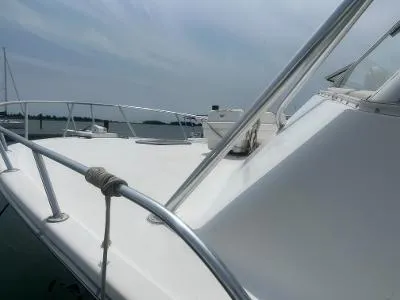 Slide: The Image of 2002 Jersey 36 Express boat deck with railing on a calm water day. - 4