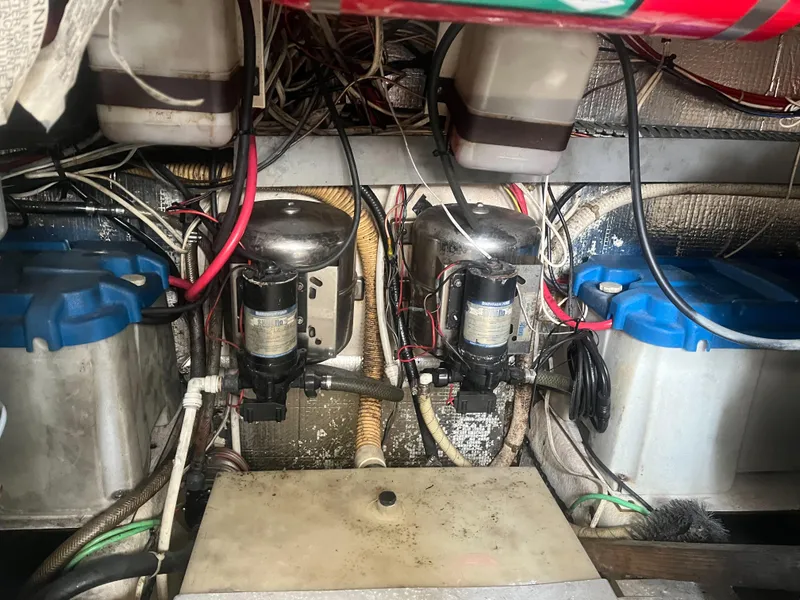 Slide: The Image of Engine room of a 2002 Jersey 36 Express boat with wiring and components. - 42