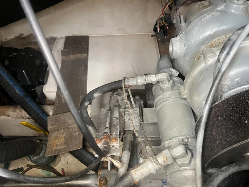 Slide: The Image of Engine compartment of a 2002 Jersey 36 Express boat showing mechanical components. - 44