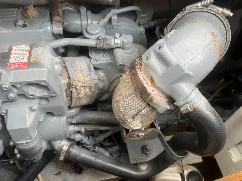 Slide: The Image of 2002 Jersey 36 Express engine close-up showing mechanical components and piping. - 47