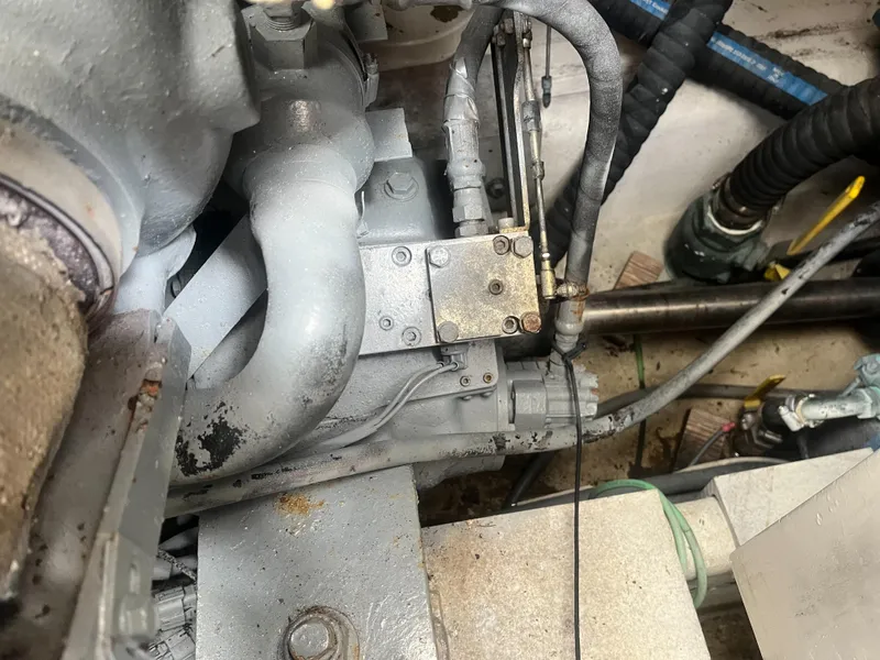 Slide: The Image of Engine compartment of a 2002 Jersey 36 Express boat showing mechanical components. - 49