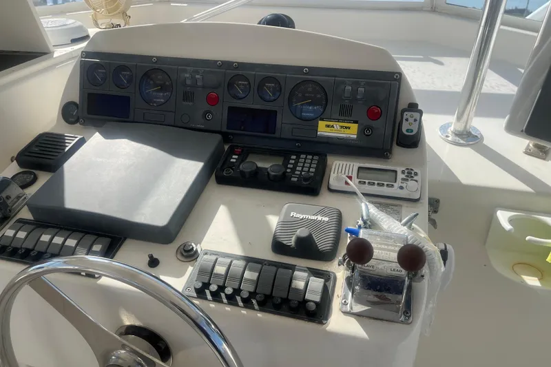 Slide: The Image of Control panel of a 2002 Jersey 36 Express boat with navigation instruments. - 66