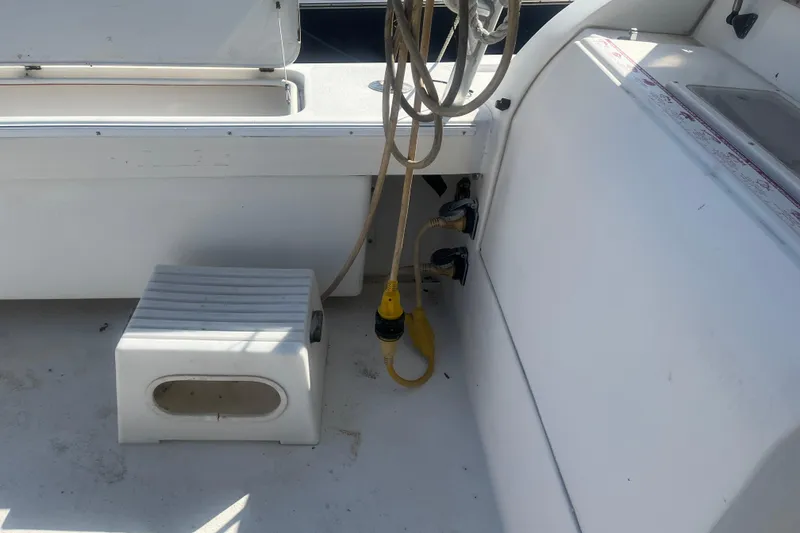 Slide: The Image of 2002 Jersey 36 Express boat deck with cables and step stool. - 68