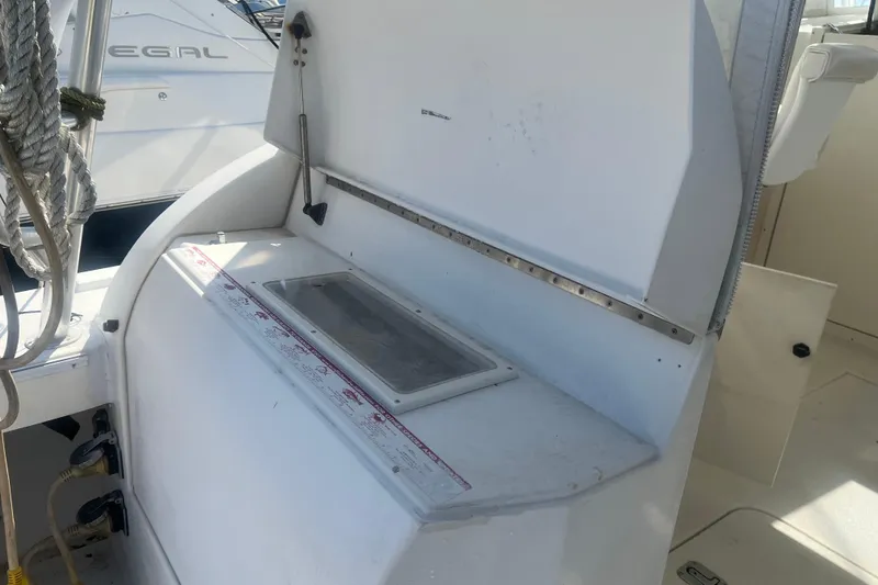 Slide: The Image of 2002 Jersey 36 Express boat interior with storage compartment and ropes. - 69