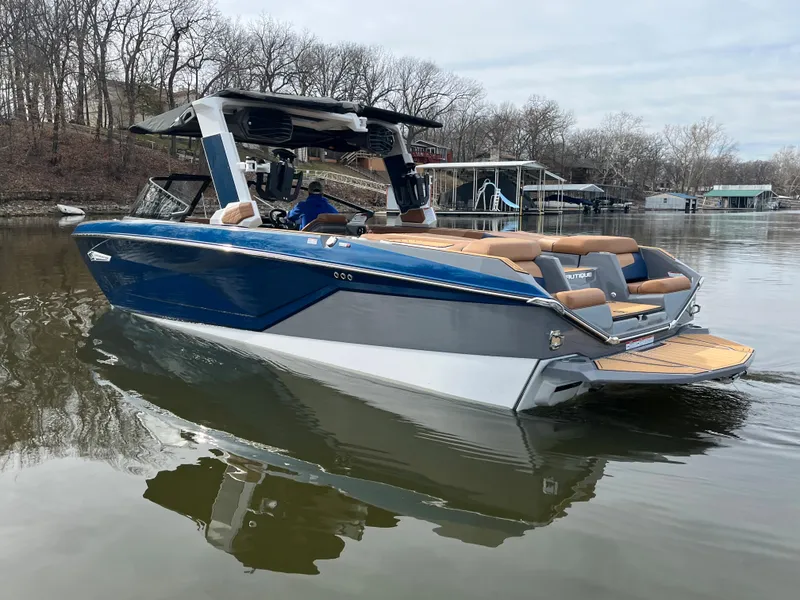 Slide: The Image of 2023 Nautique Super Air Nautique G25 on a calm lake. - 3