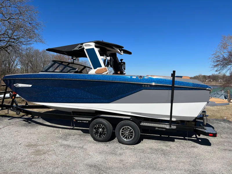 Slide: The Image of 2023 Nautique Super Air Nautique G25 on trailer, blue sky. - 6