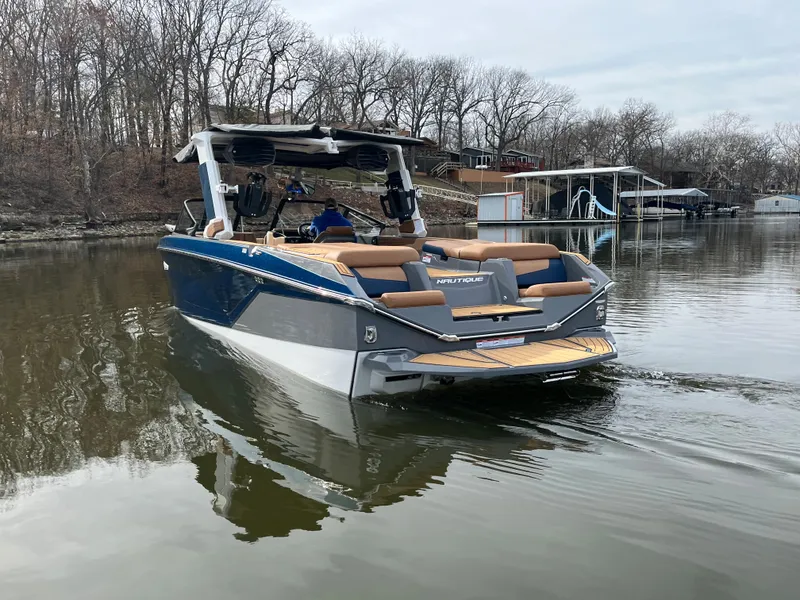 Slide: The Image of 2023 Nautique Super Air Nautique G25 on a calm lake. - 7