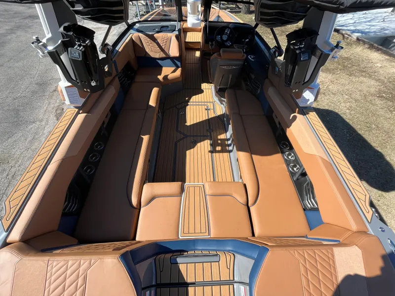 Slide: The Image of Interior of 2023 Nautique Super Air Nautique G25 with luxurious leather seating. - 9