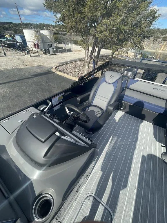 Slide: The Image of 2023 Berkshire 25UL STS 3.0 boat interior with sleek seating and modern controls. - 14