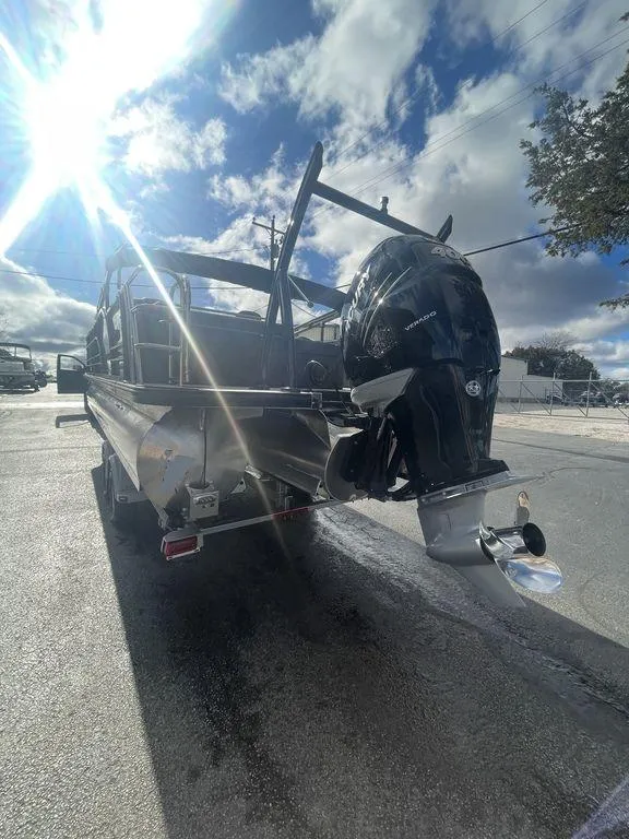 Slide: The Image of 2023 Berkshire 25UL STS 3.0 boat with powerful outboard motor under sunny sky. - 4