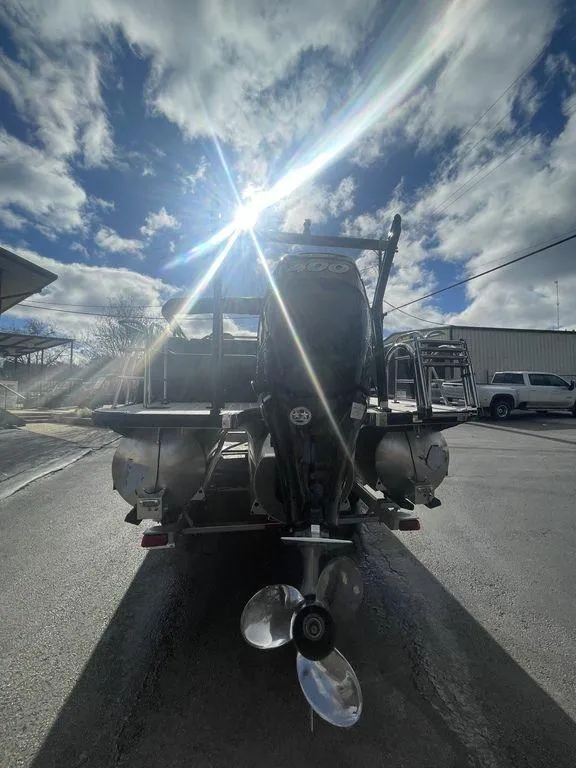 Slide: The Image of 2023 Berkshire 25UL STS 3.0 boat with outboard motor under a bright sunlit sky. - 5