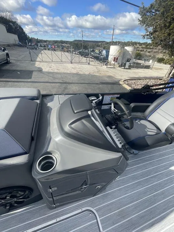 Slide: The Image of 2023 Berkshire 25UL STS 3.0 boat interior with steering console and seating. - 7