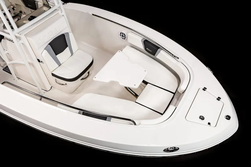Slide: The Image of 2025 Robalo R200 Center Console boat interior with seating and table. - 15