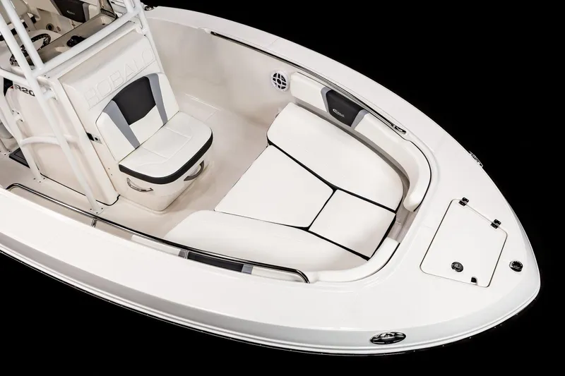 Slide: The Image of 2025 Robalo R200 Center Console boat interior with white seating and console. - 16