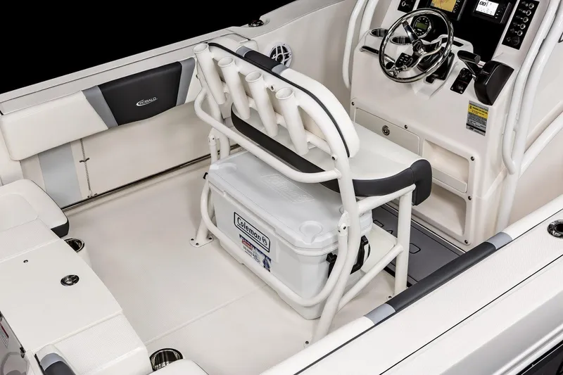 Slide: The Image of 2025 Robalo R200 Center Console boat interior with seating and steering console. - 19