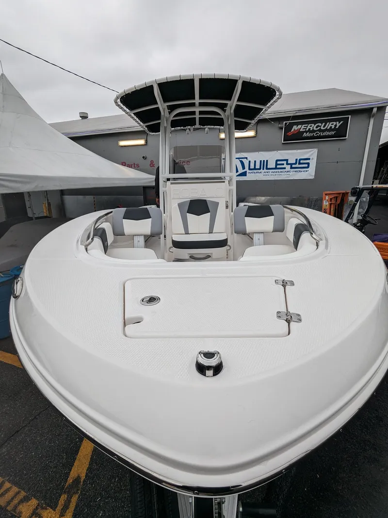 Slide: The Image of 2024 Robalo R200 Center Console boat displayed at a dealership. - 3