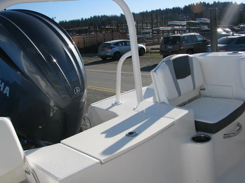 Slide: The Image of 2025 Robalo R200 Center Console boat with Yamaha engine, parked outdoors. - 30
