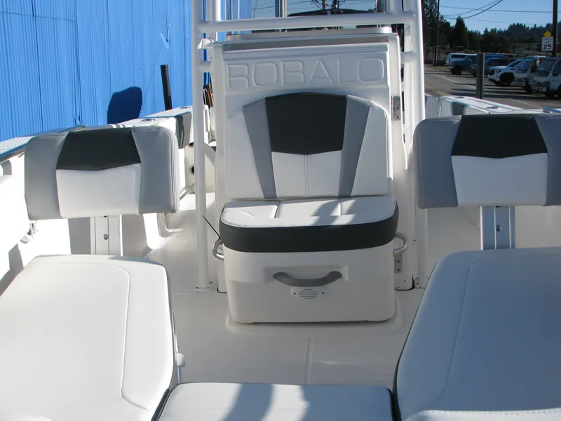 Slide: The Image of 2025 Robalo R200 Center Console boat interior with cushioned seating. - 9