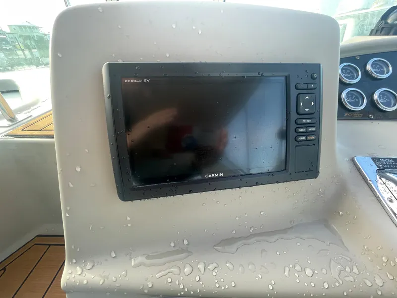 Slide: The Image of Garmin GPS display on 2004 Cruisers Yachts 320 Express dashboard, with water droplets. - 20