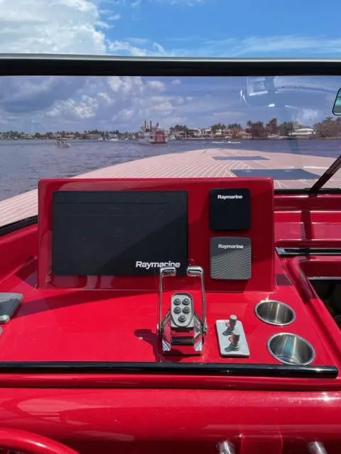Slide: The Image of Red 2010 VanDutch 40 boat dashboard with Raymarine navigation system. - 10