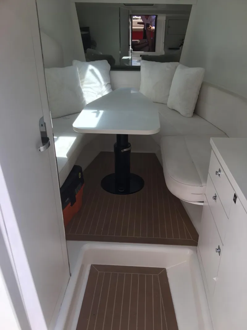 Slide: The Image of Interior of 2010 VanDutch 40 yacht with white seating and table. - 14