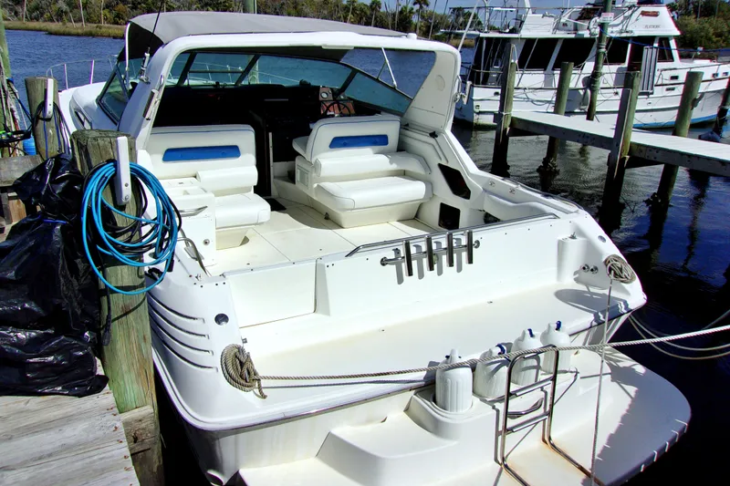 Slide: The Image of 1992 Sea Ray 400 Express Cruiser docked at marina, rear view. - 3