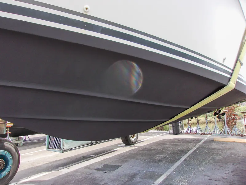 Slide: The Image of 1992 Sea Ray 400 Express Cruiser hull on dry dock, showcasing sleek design and craftsmanship. - 30