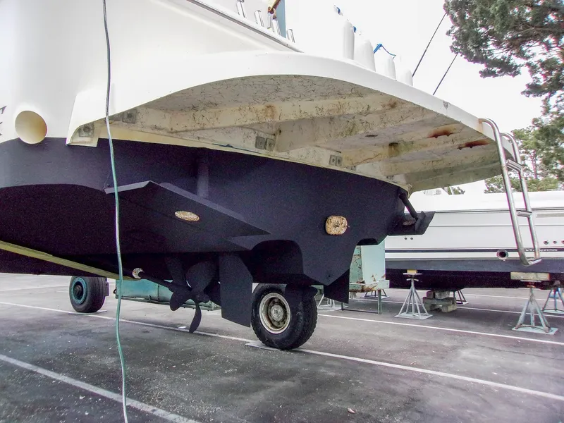 Slide: The Image of 1992 Sea Ray 400 Express Cruiser on trailer in boatyard. - 31