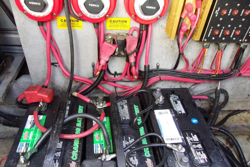 Slide: The Image of 1992 Sea Ray 400 Express Cruiser battery compartment with wiring and switches. - 33