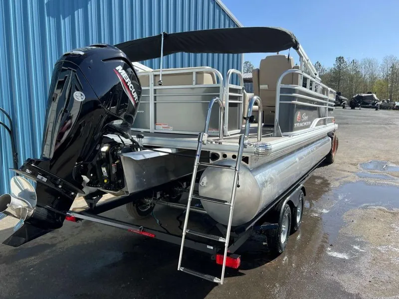 Slide: The Image of 2023 Sun Tracker PARTY BARGE® 20 DLX pontoon boat with Mercury outboard motor. - 6