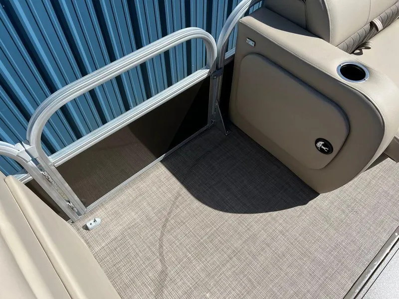 Slide: The Image of 2023 Sun Tracker SportFish™ 22 XP3 boat interior with beige seating and flooring. - 5