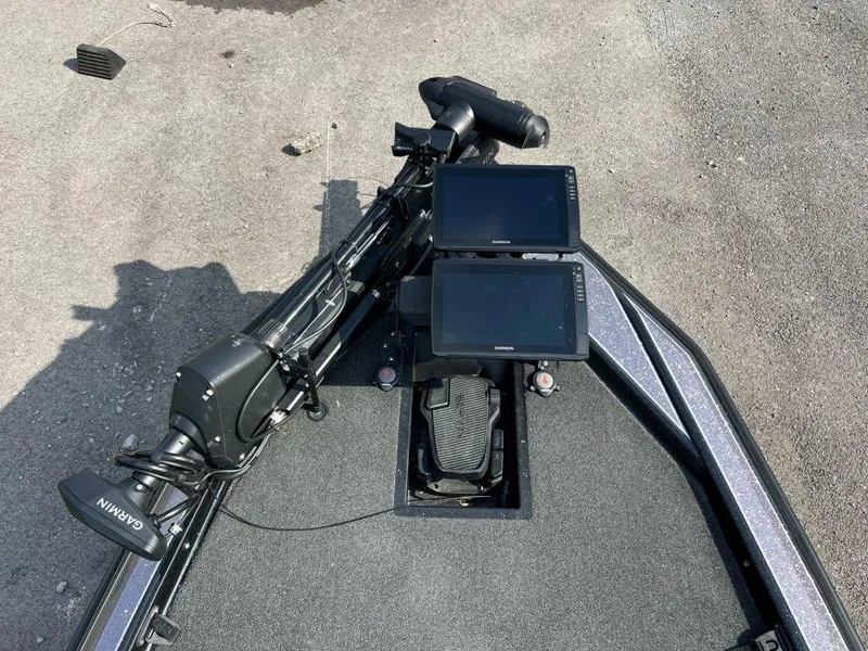 Slide: The Image of 2022 Bullet 21XRS boat with Garmin electronics and trolling motor setup. - 2