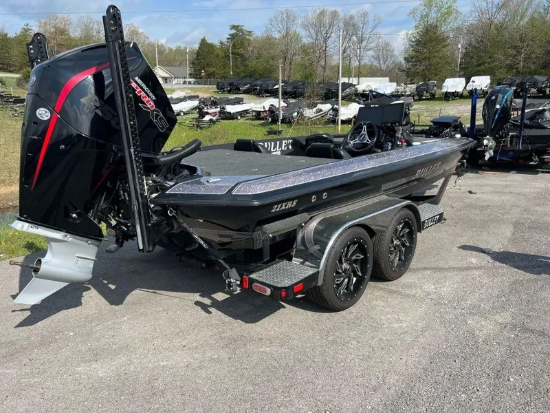 Slide: The Image of 2022 Bullet 21XRS boat with powerful outboard motor on a trailer. - 3