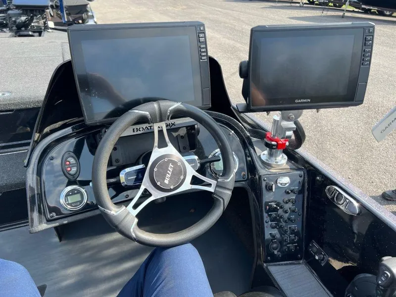 Slide: The Image of 2022 Bullet 21XRS boat dashboard with dual Garmin displays and steering wheel. - 5