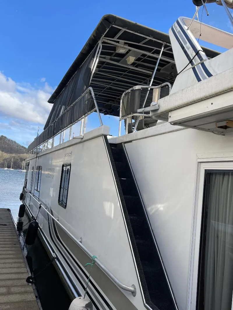 Slide: The Image of Sumerset 16x75 houseboat, 2000 model, docked with upper deck and canopy. - 21