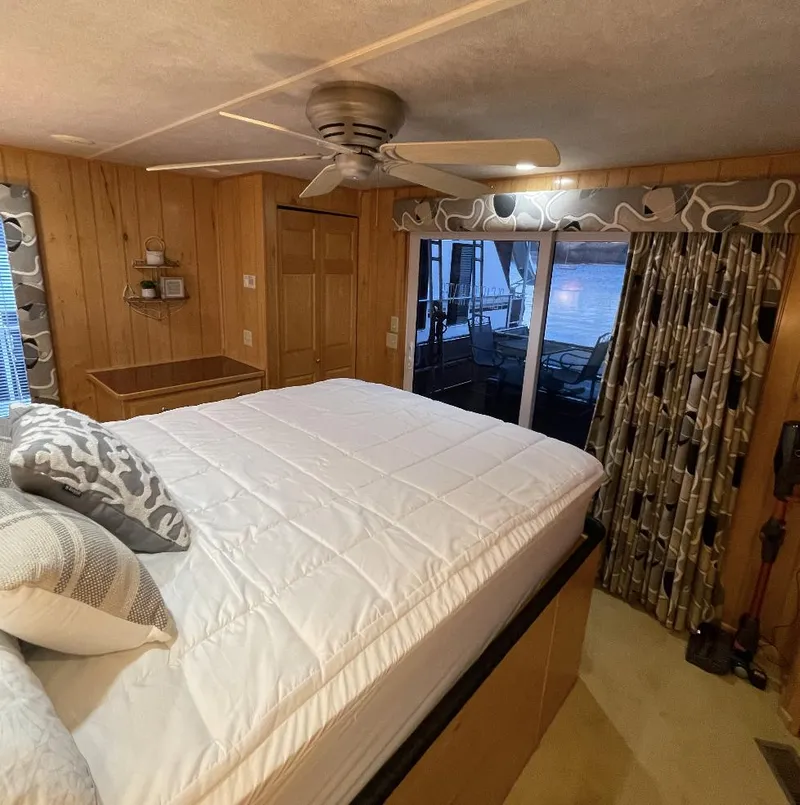 Slide: The Image of Cozy bedroom in 2000 Sumerset 16x75 houseboat with lake view. - 23