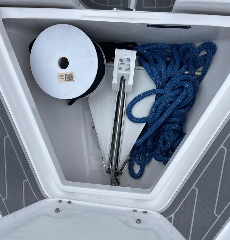 Slide: The Image of Anchor compartment of 2022 Airship 300 DS with blue rope and spool. - 19