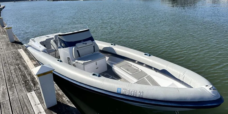 Slide: The Image of Airship 300 DS 2022 inflatable boat docked on calm water. - 3