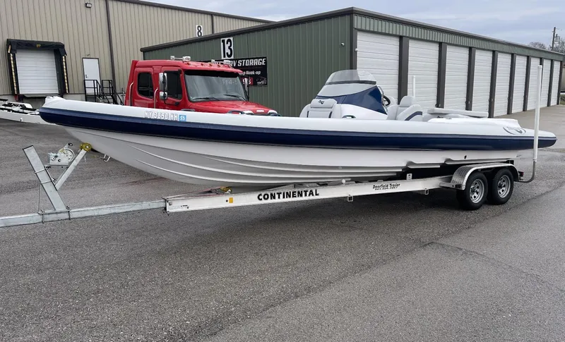 Slide: The Image of 2022 Airship 300 DS boat on Continental trailer in industrial area. - 8